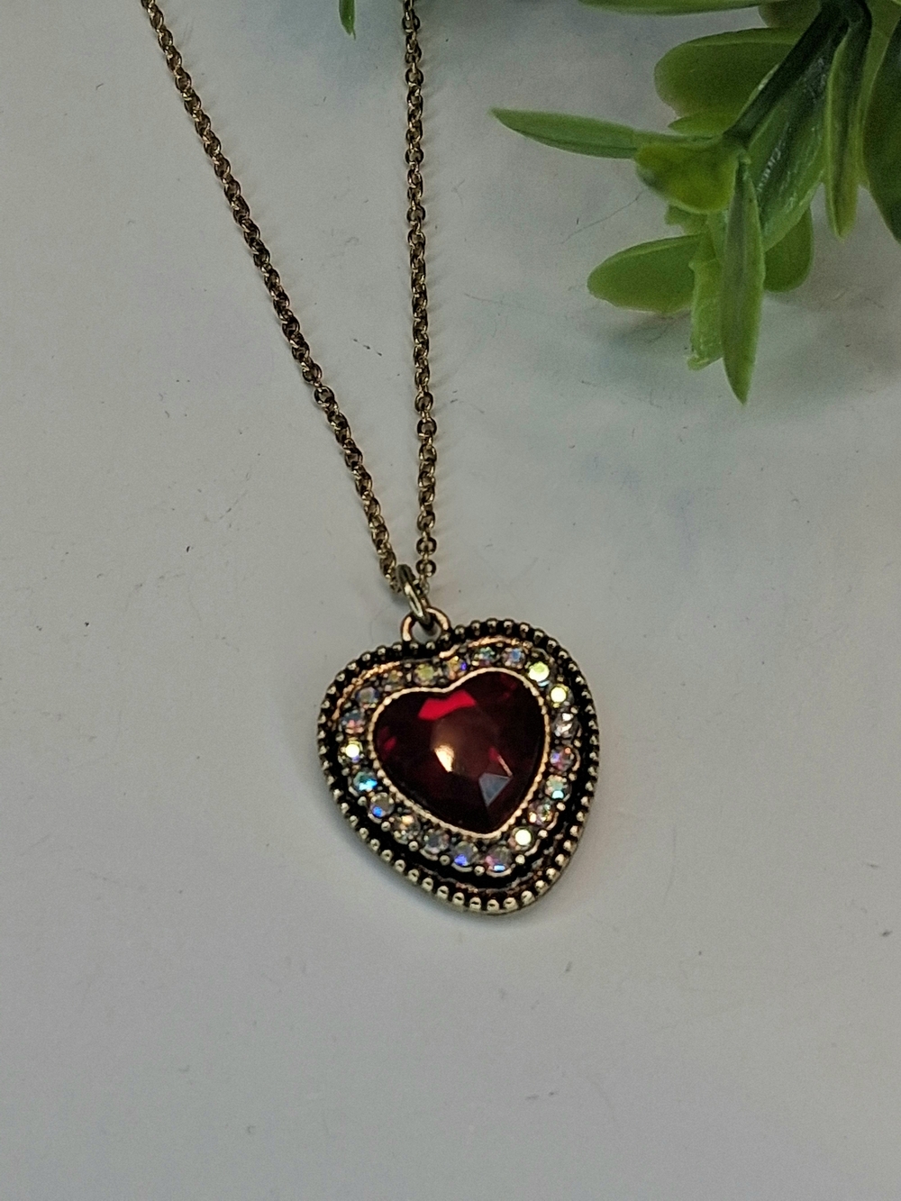 Gold-Tone Heart Pendant Necklace with Deep Red And Iridescent Crystals